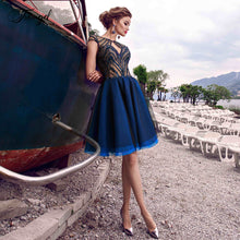 Load image into Gallery viewer, Traugel Illusion Scoop A Line Short Cocktail Dresses Applique Seqiuns 3D Flower Cap Sleeve Backless Mini Prom Evening Party Gown